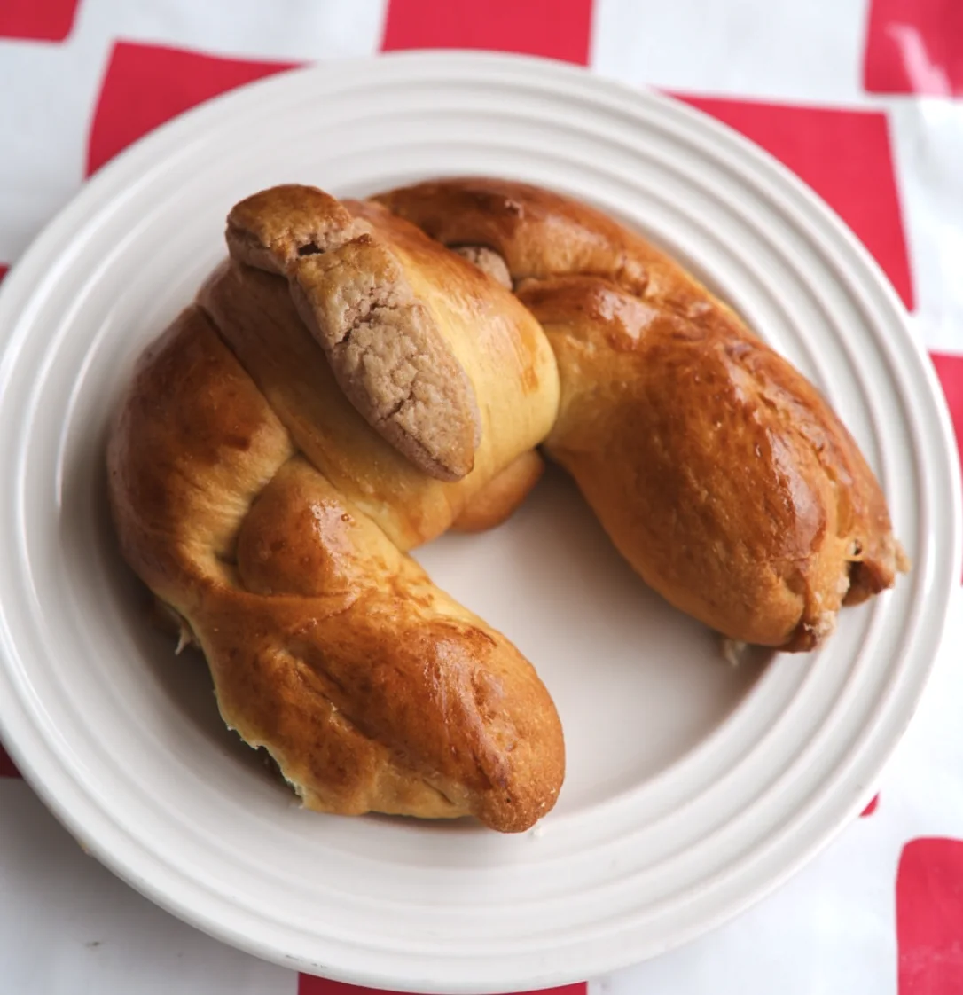 Freshly baked filled rolls on a white plate