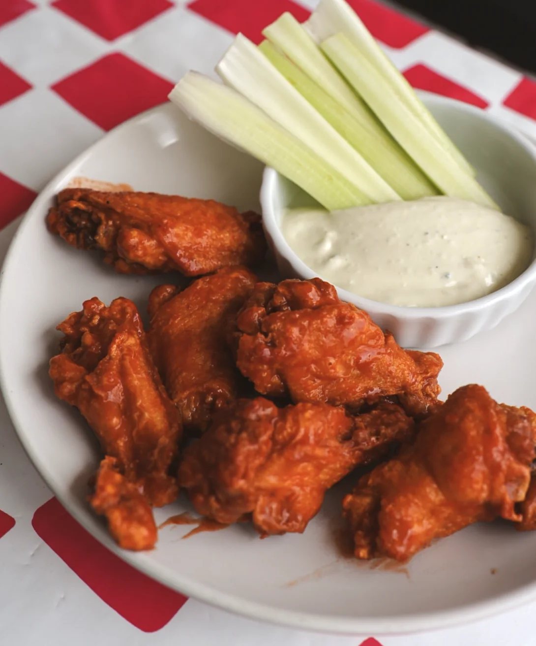 Buffalo wings served with celery and creamy dressing