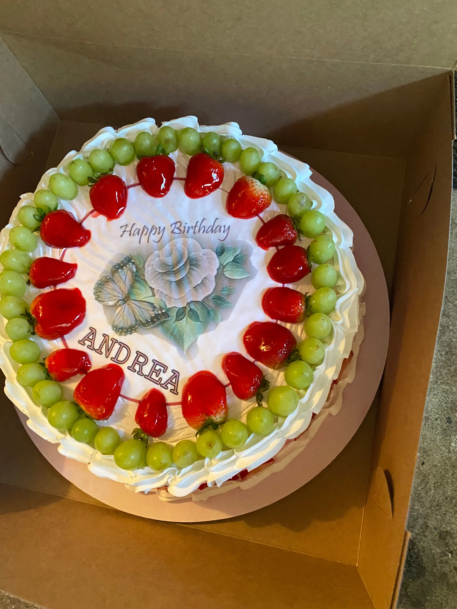 A fruit-topped celebration cake from Mario’s bakery