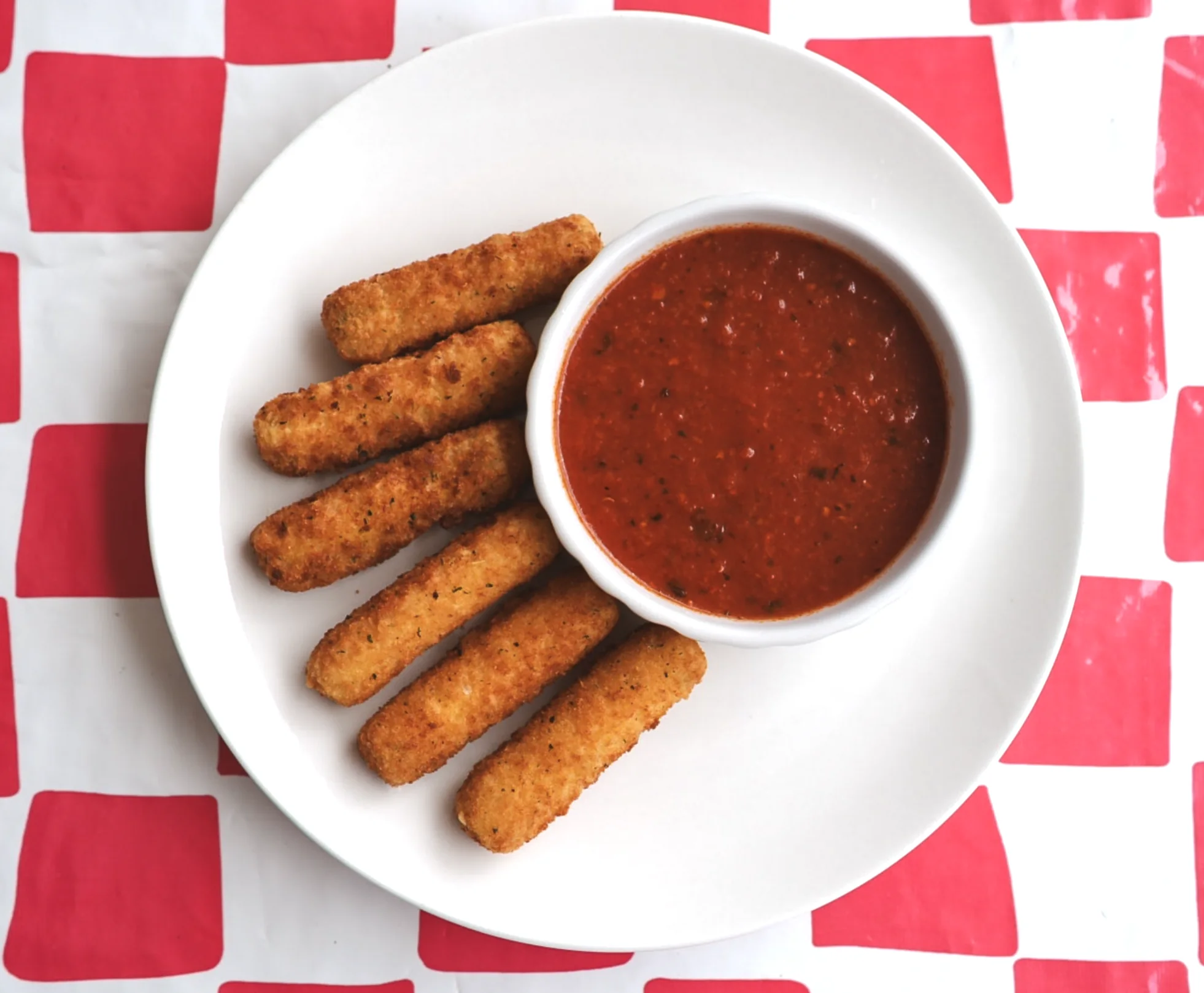 Fried mozzarella sticks served with tomato sauce