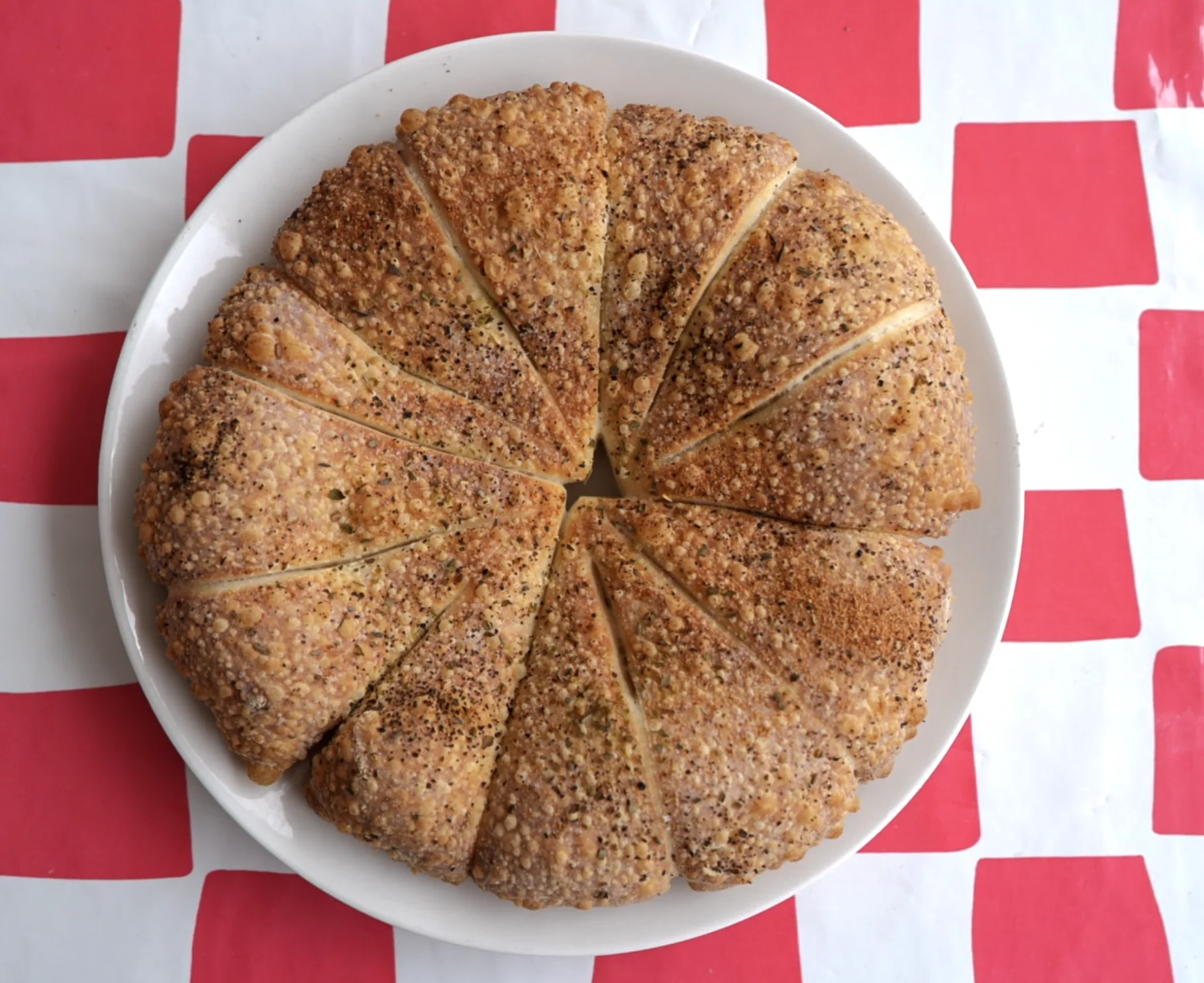 Seasoned baked bread bites arranged on a plate